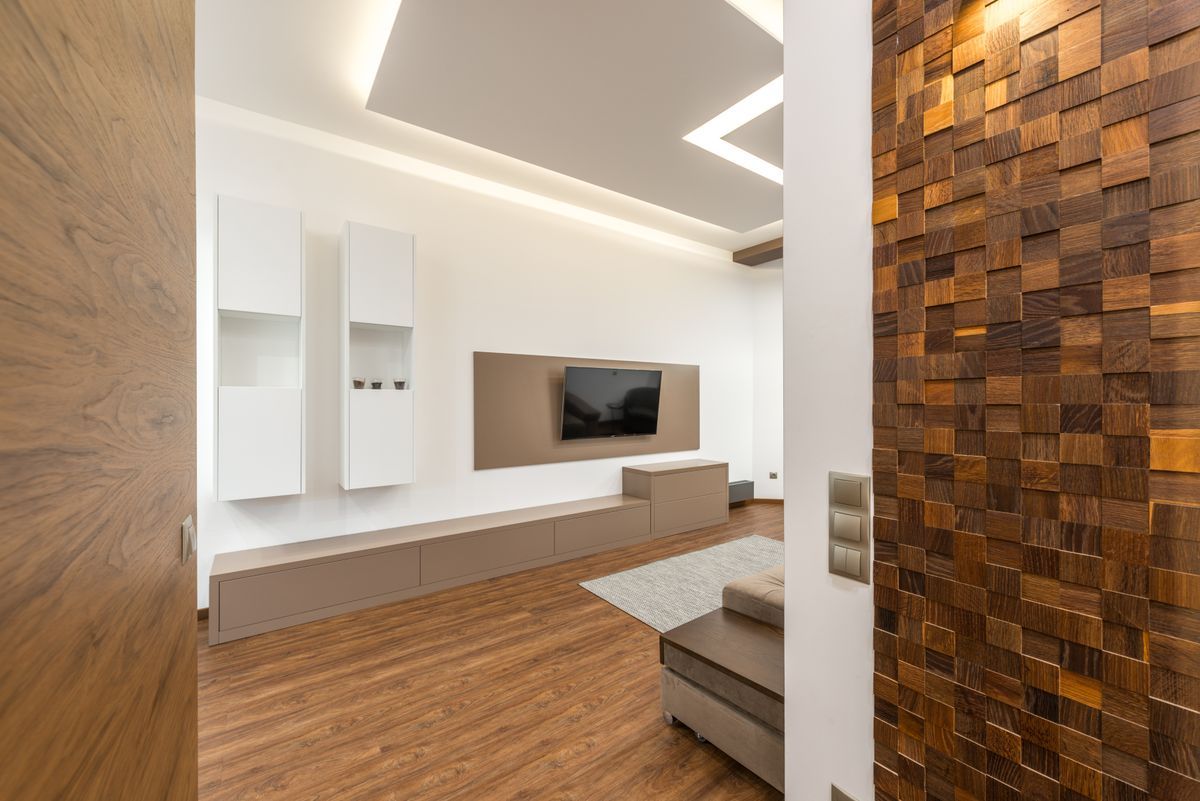 Inspiration: a TV set into a white media wall beside wood paneling
