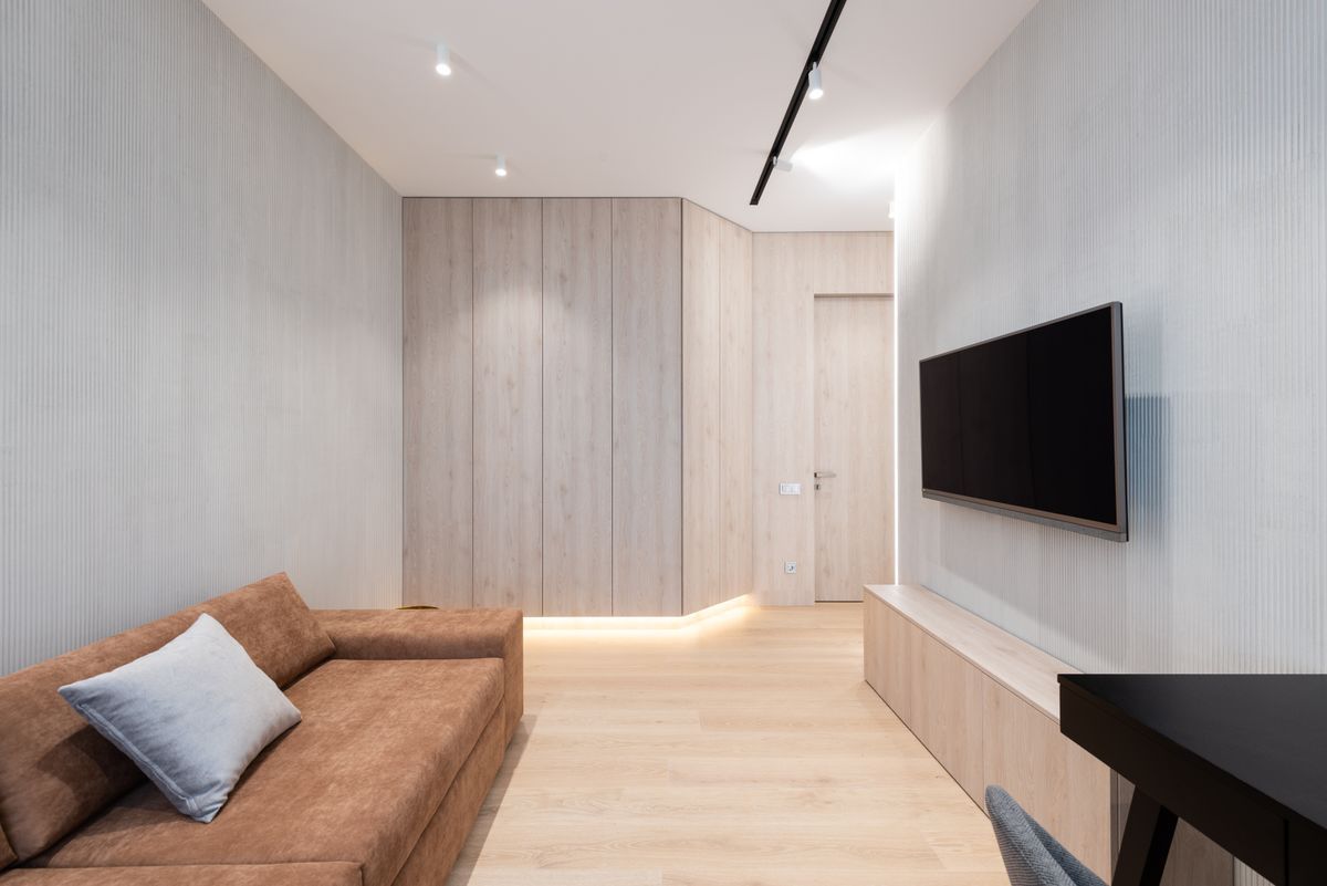 Inspiration: a wall-mounted TV at the end of a long, light living room